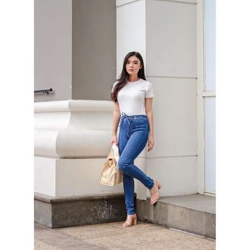 person in a white t - shirt and jeans