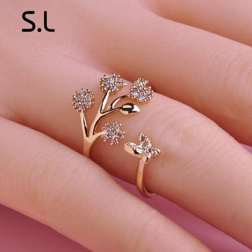 a ring with a tree and a bird on it.