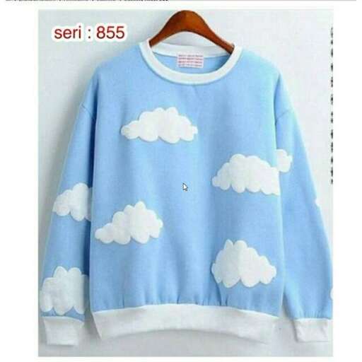 blue sweater with clouds in the sky