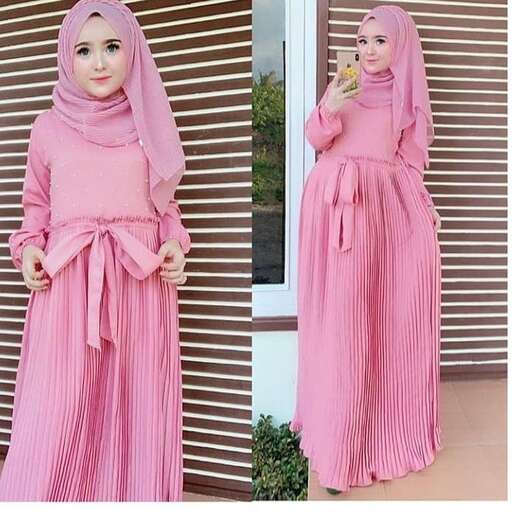 a girl in a pink dress