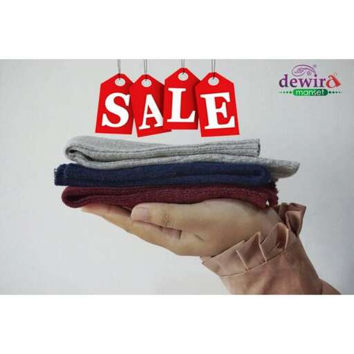 a stack of clothes for sale