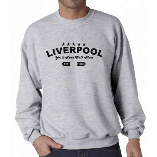 a man wearing a grey sweatshirt with the word 