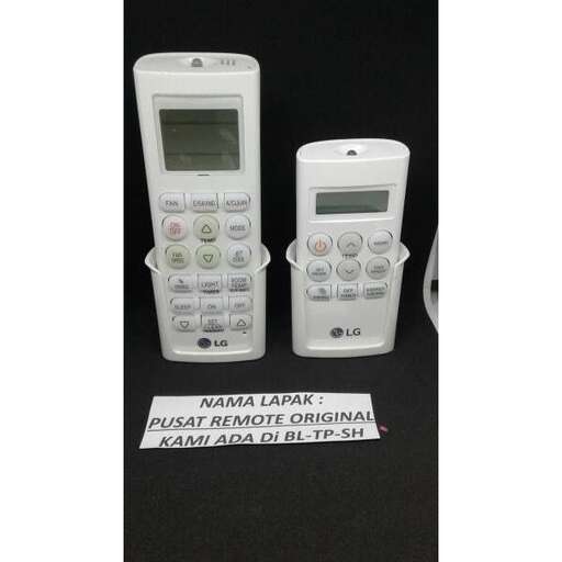 two white cell phones sitting on a black table.