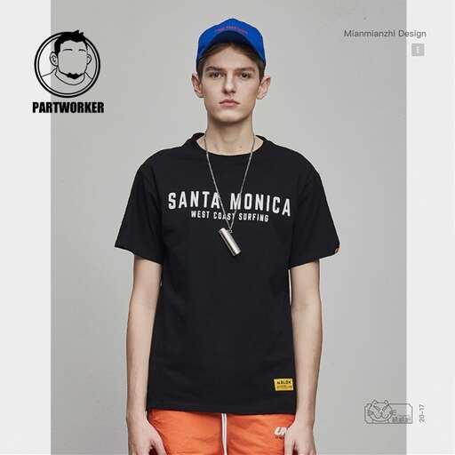 a black tee shirt with a white logo on the front and orange shorts on the front.