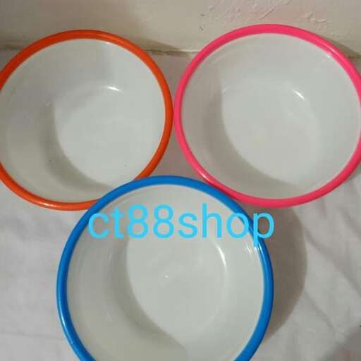 a set of plates with different colored rims.
