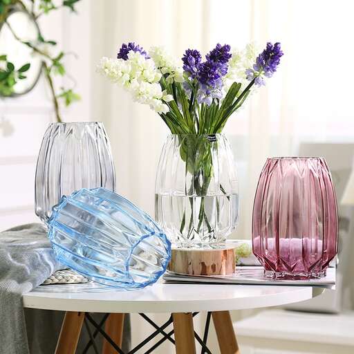 a table with a vase and flowers on it