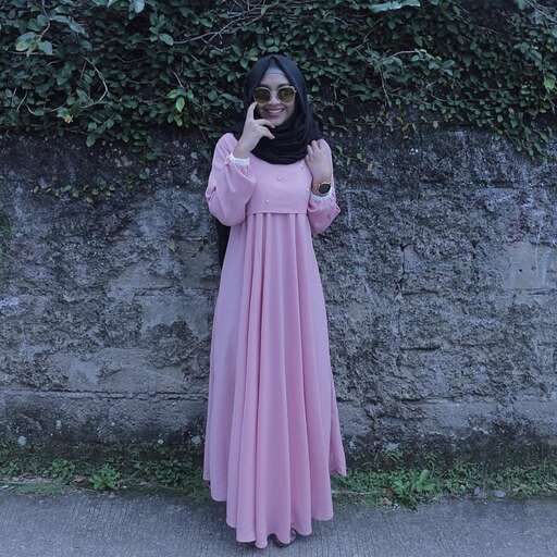 a woman in a long pink dress