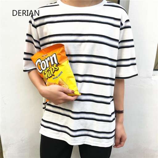 a boy in a striped t - shirt with a bag of chips