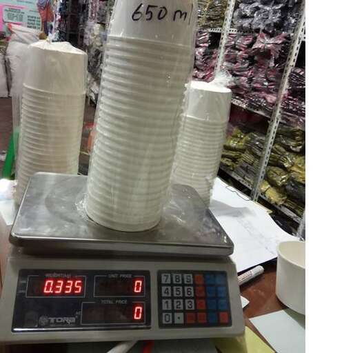 a scale with a digital timer and cups on it.