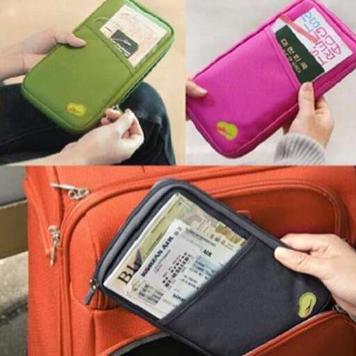 a person holding a wallet with a credit card in their hand.