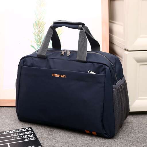 a large blue bag sitting on top of a carpet.