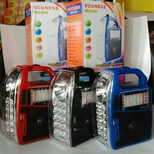 a display of old cell phones in a box.