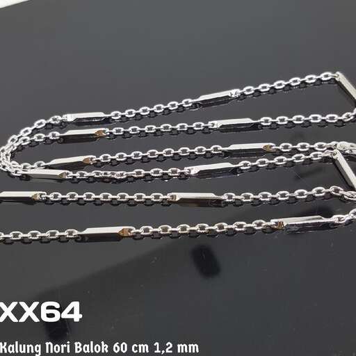 a set of silver chain and chain on a black table.