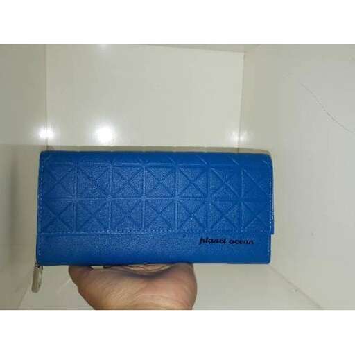 a hand holding a blue box with a white background.