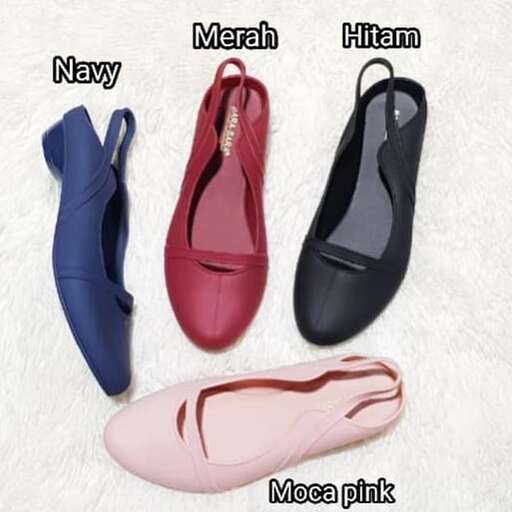 a pair of shoes with different shoes on a white blanket.