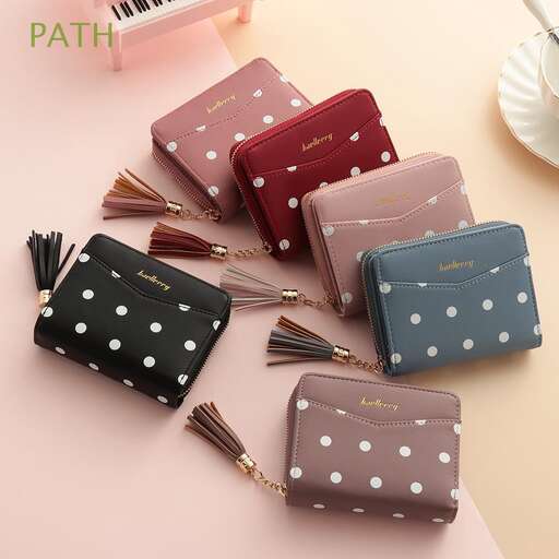 a cute little purse with polka dots on it.