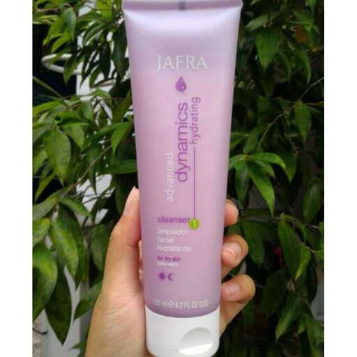 a bottle of shampoo in a hand