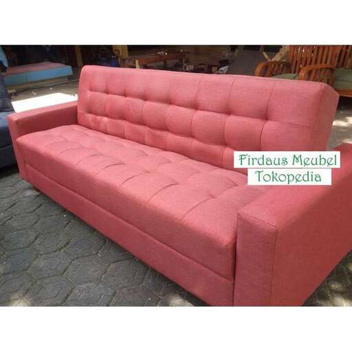 a large pink couch for a living room.