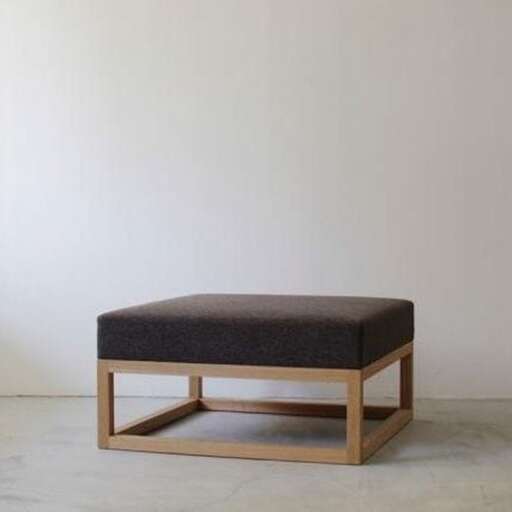 a wooden bench with a cushion on it