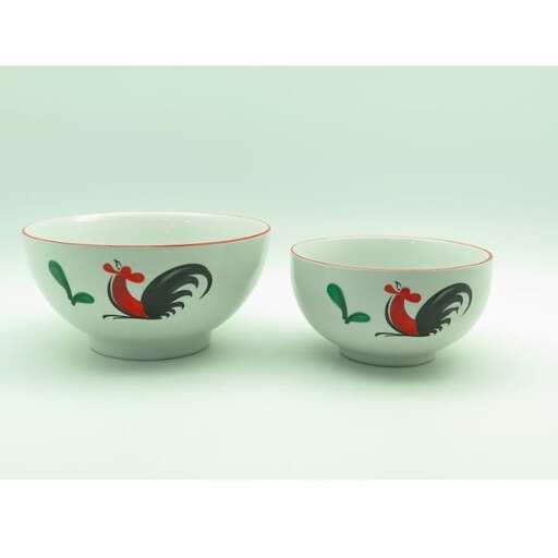 a pair of bowls with roosters on them.