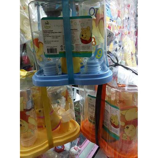 a set of three baby toys in a plastic container.