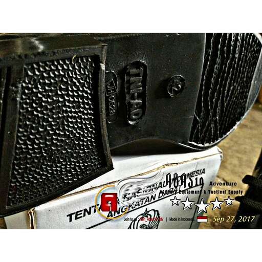 a close up of a black and white tool.