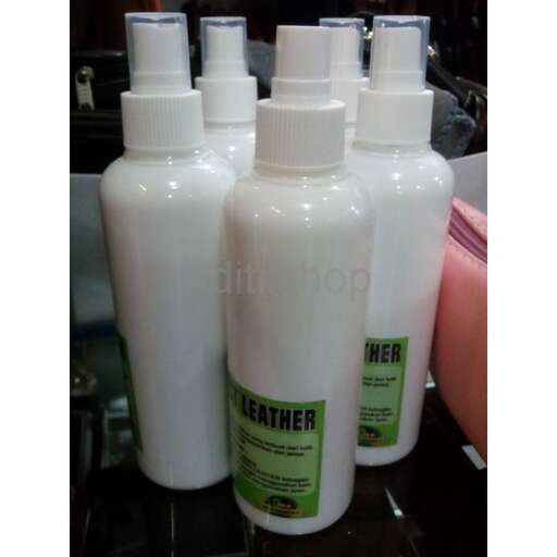 a black counter top with bottles of shampoo and conditioner.