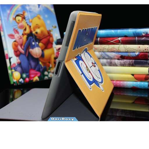 a laptop computer sitting on top of a desk next to a picture of a mouse.