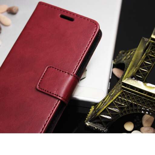 a red leather wallet with a gold frame and a gold frame.