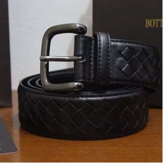 a black leather belt with a lock on it.