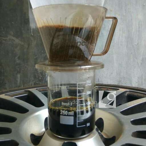 a coffee maker with a coffee pot on top of it.