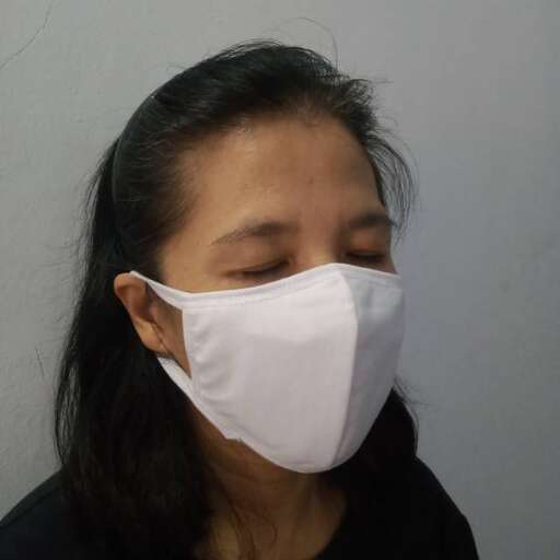 a woman wearing a face mask while wearing a mask.