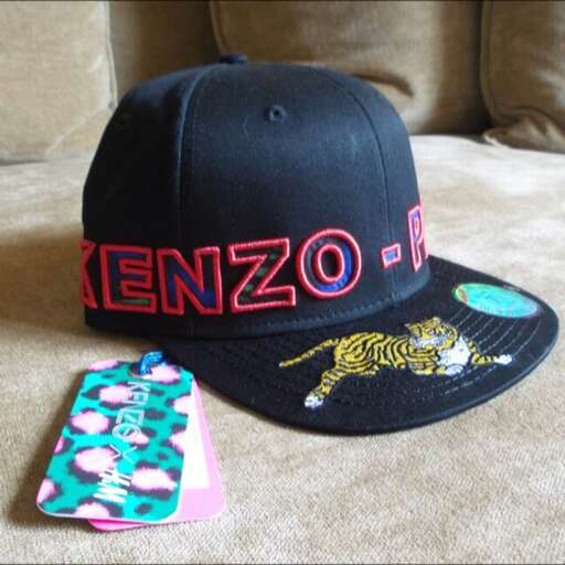 a hat and a phone case in the shape of a baseball cap.