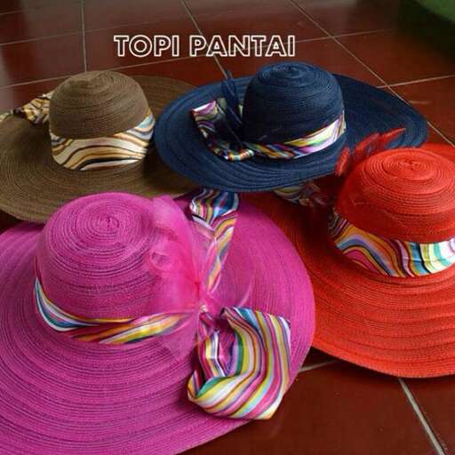 a group of hats with colorful ties on them.