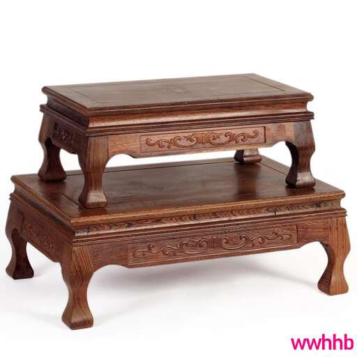 a pair of early 19th century carved wooden tables