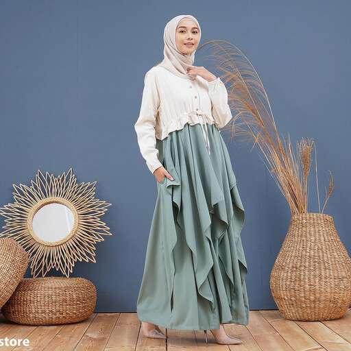 a woman in a white blouse and skirt