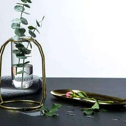 a vase with a flower in it and a flower in it.