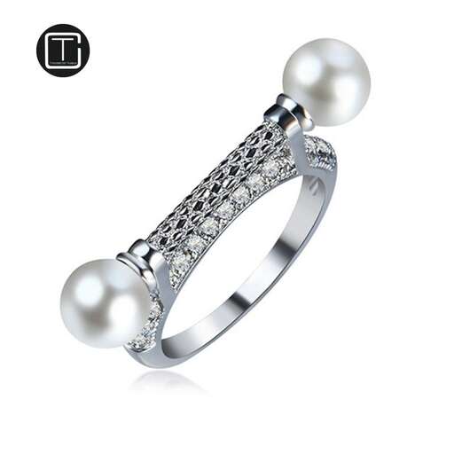 a ring with a pearl and diamonds