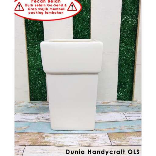 a white toilet sitting next to a white toilet.