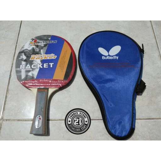 a pair of tennis shoes sitting on a tile floor.