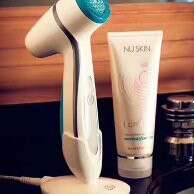 a white hair dryer sitting on top of a black counter.