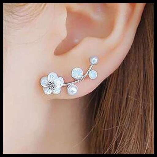 earrings with a flower on the ear