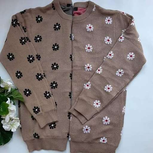 a brown sweater with flowers and a sweater.