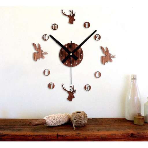 a wall clock with deer on it.