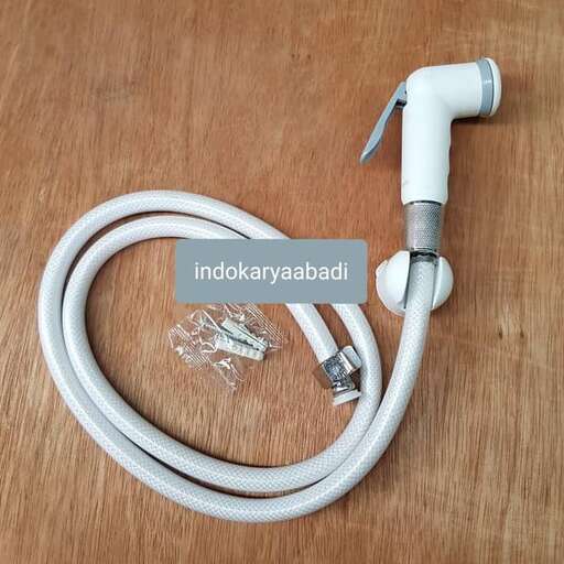 the coiled white cord is wrapped around the tube.