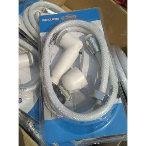 a bunch of white cords in a blue box.