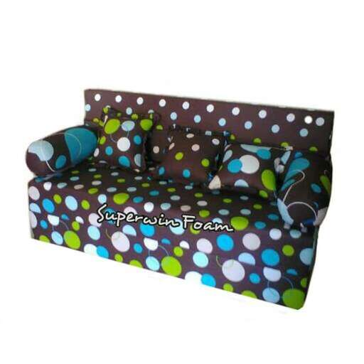 a couch with a blue and green polka dot pattern.