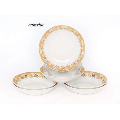 a set of gold plated plates and cups.