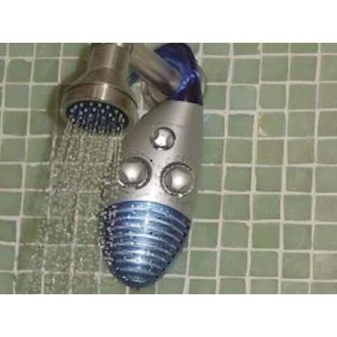 a silver faucet with a blue face mask.