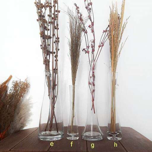 a table with several glass vases on it.